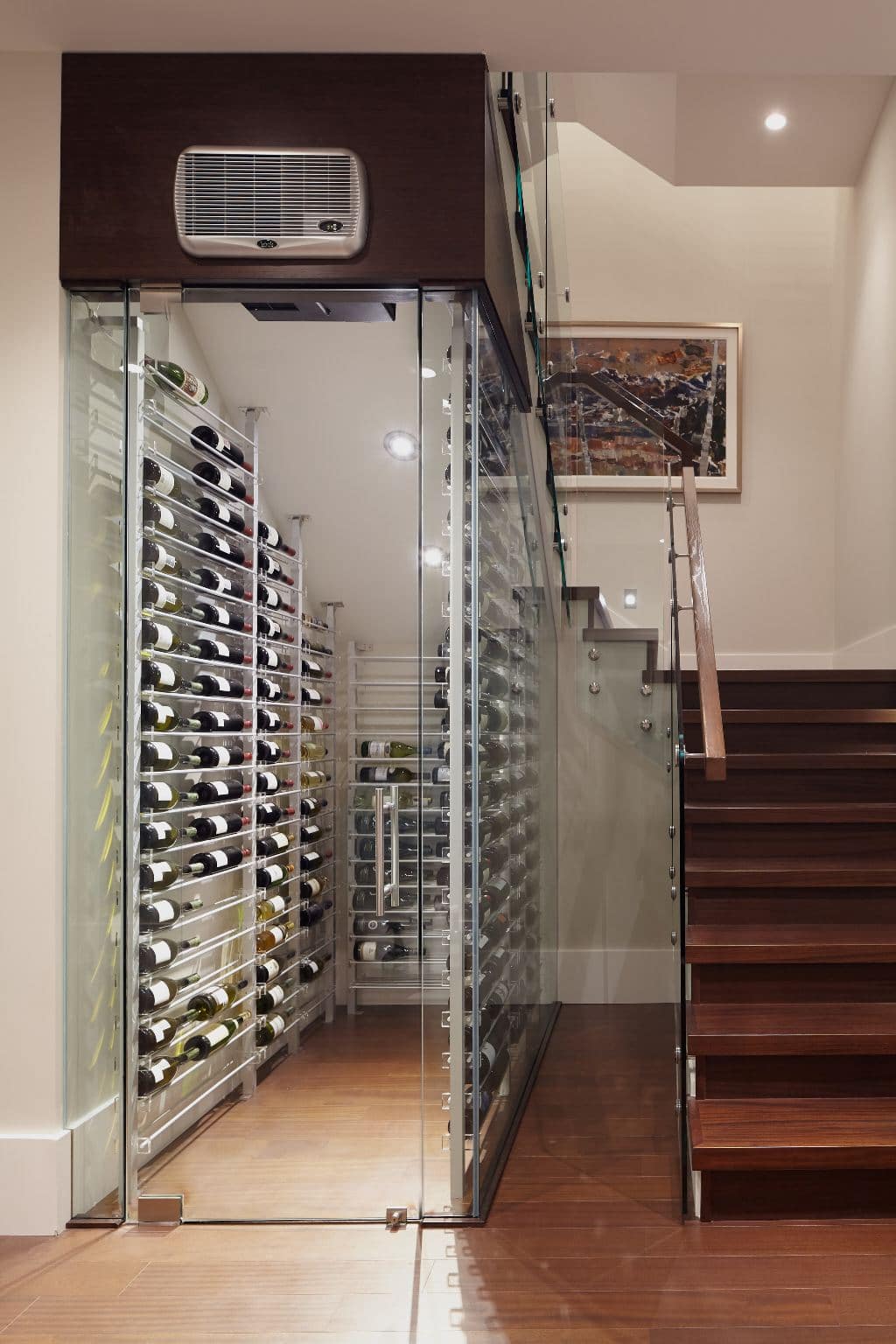 Los Angeles Builder Installed a Custom Glass Wine Cellar Under the Stairs
