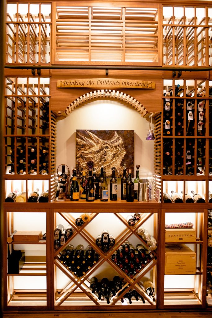 North Dallas transitional wine cellar with woodern racks