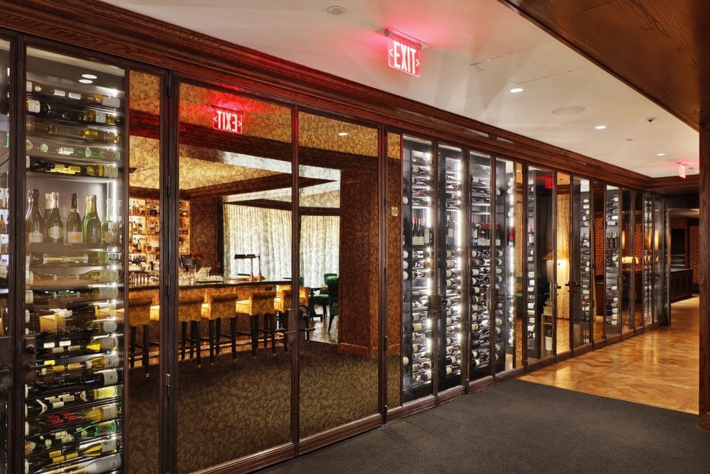 Love modern and contemporary designs? Click here to see more. classy-wine-cellar-at-restaurant-entrance