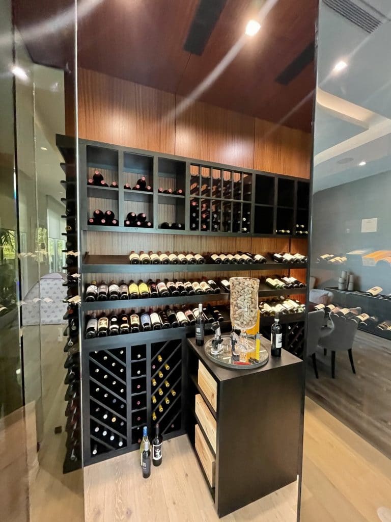 Luxury Wine Cellar Display with Wood and Glass Elements