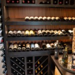 Modern wooden wine racking is a perfect option in transitional home wine cellars.