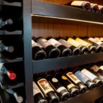 LED lighting illuminates these display rows, to show off the beautiful labels in this home wine cellar.