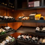 Custom wooden wine shelving can be used to store bottles in multiple sizes, and even boxes.