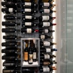 Triple-deep metal peg racking means this small wine closet can hold an impressive 160 bottles.