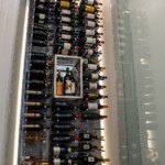 A frameless glass door is a beautiful and easy way to access your wine collection.