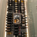 The display nook in the center of this wine wall is a wonderful place to display beautiful bottles.