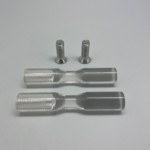 Unlike Wine Display Tech's metal pegs, the screw of acrylic pegs don't protrude. They're more like nuts and comes with a pair of bolts for fastening.